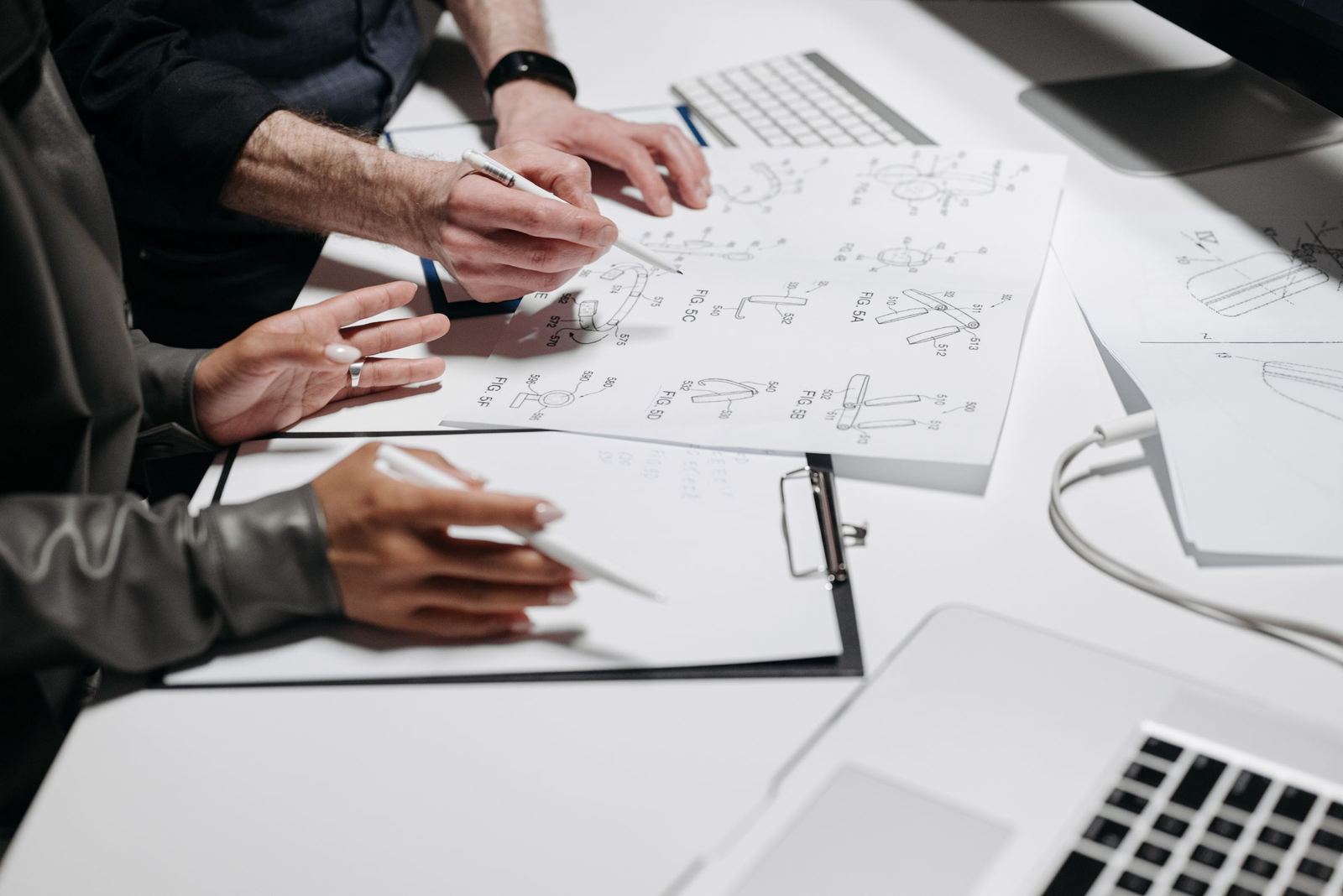 Technical drawings and documents on a desk
